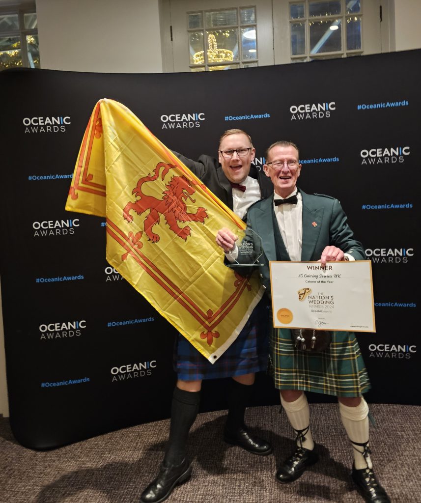 George with his manager Jonathan Hess proudly showing the Nations Award for Catering of the Year UK and of course the Scottish flag.